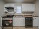 Bright kitchen featuring stainless steel oven, dishwasher, double sink and plenty of counter space at 6112 Shadow Rock Ln, Lithonia, GA 30058