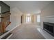 An expansive living room with fireplace, staircase and door to the exterior at 6112 Shadow Rock Ln, Lithonia, GA 30058