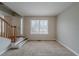 Inviting carpeted living room with natural light, staircase and front door at 6112 Shadow Rock Ln, Lithonia, GA 30058