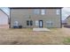 Spacious backyard with patio, green grass, and newly installed central air conditioning at 1160 Faulkner Way, Jonesboro, GA 30238