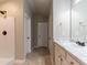 Neutral bathroom features a shower, a double door closet, and a vanity with marble countertops at 1160 Faulkner Way, Jonesboro, GA 30238
