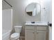 Clean bathroom with a toilet, white vanity, and a shower and tub combination at 1160 Faulkner Way, Jonesboro, GA 30238