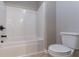 Bathroom featuring a white tiled tub and toilet at 1160 Faulkner Way, Jonesboro, GA 30238