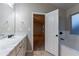 Bathroom featuring a white vanity, white cabinets and marble countertop at 1160 Faulkner Way, Jonesboro, GA 30238