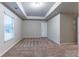 Bedroom featuring neutral walls, carpet flooring and tray ceiling detail at 1160 Faulkner Way, Jonesboro, GA 30238