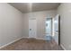 Cozy bedroom features plush carpet, neutral walls, and access to the ensuite bathroom at 1160 Faulkner Way, Jonesboro, GA 30238