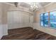 Dining room with decorative walls, hardwood floors, and a stylish light fixture at 1160 Faulkner Way, Jonesboro, GA 30238
