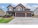 Inviting two-story home with brick facade, two-car garage, and landscaped front yard at 1160 Faulkner Way, Jonesboro, GA 30238
