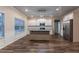 Bright kitchen with stainless steel appliances, a center island, and wood-look flooring at 1160 Faulkner Way, Jonesboro, GA 30238