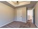 Bedroom with plush carpet and tray ceiling, offering a neutral and comfortable space at 1160 Faulkner Way, Jonesboro, GA 30238