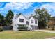 Charming two-story home with white siding, black shutters, attached garage, and landscaped front yard at 2954 Lighthouse Ct, Acworth, GA 30101
