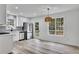 Well-lit kitchen with stainless steel appliances, granite countertops, and ample cabinet space at 2954 Lighthouse Ct, Acworth, GA 30101