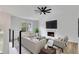 Bright living room with modern furnishings, a fireplace, and large windows overlooking the yard at 2954 Lighthouse Ct, Acworth, GA 30101