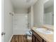 Bathroom featuring a shower-tub combination, toilet, vanity and wood-look floors at 450 Lake Ridge Ln, Fairburn, GA 30213