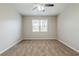 A bright bedroom with neutral carpet and a large window at 450 Lake Ridge Ln, Fairburn, GA 30213