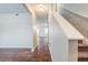 Bright entryway with hardwood floors and a staircase leading to the upper level at 450 Lake Ridge Ln, Fairburn, GA 30213