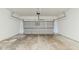 Spacious garage with a concrete floor and a large, sectional garage door at 450 Lake Ridge Ln, Fairburn, GA 30213