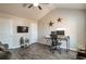 Bright bedroom featuring a desk, TV, vaulted ceilings, and decor at 531 Eagles Nest Cir, Auburn, GA 30011