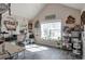Upstairs bonus room with lots of natural light, wood-look floors and neutral walls at 531 Eagles Nest Cir, Auburn, GA 30011