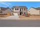 Charming two-story home with a well-manicured front yard and a two-car garage on a sunny day at 531 Eagles Nest Cir, Auburn, GA 30011