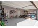 Bright garage featuring epoxy flooring, overhead storage, and organization at 531 Eagles Nest Cir, Auburn, GA 30011