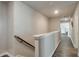 Upstairs hallway featuring wood-look floors and neutral paint colors at 531 Eagles Nest Cir, Auburn, GA 30011