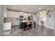 Spacious kitchen with white cabinets, a dark island with seating, and modern stainless steel appliances at 531 Eagles Nest Cir, Auburn, GA 30011