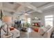 Cozy living room with coffered ceiling, fireplace, neutral paint, and large windows that offer plenty of light at 531 Eagles Nest Cir, Auburn, GA 30011