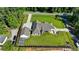 Aerial view of a luxury home on a sprawling lot with a long driveway and lush landscaping at 783 Blackberry Trl, Lawrenceville, GA 30043