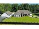 Expansive backyard with lush green lawn, privacy fencing, and a view of the home's rear exterior at 783 Blackberry Trl, Lawrenceville, GA 30043