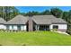 Spacious backyard with green lawn and covered patio, perfect for outdoor entertaining at 783 Blackberry Trl, Lawrenceville, GA 30043
