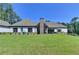 Expansive backyard with a well-maintained lawn and a view of the house exterior at 783 Blackberry Trl, Lawrenceville, GA 30043