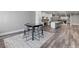 Open concept basement with a large island, kitchen, dining area and hardwood floors at 783 Blackberry Trl, Lawrenceville, GA 30043