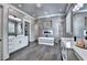 This bathroom features a soaking tub, fireplace, double vanities and access to the closet at 783 Blackberry Trl, Lawrenceville, GA 30043