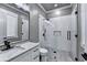 A bright bathroom features a double vanity, marble floors, and a glass-enclosed shower at 783 Blackberry Trl, Lawrenceville, GA 30043