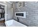 This bathroom features a soaking tub, fireplace, and double walk-in showers at 783 Blackberry Trl, Lawrenceville, GA 30043