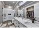 This bathroom features a walk-in closet, double vanity, and luxurious glass enclosed shower at 783 Blackberry Trl, Lawrenceville, GA 30043