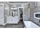 This bathroom features a soaking tub, fireplace, double vanities and access to the closet at 783 Blackberry Trl, Lawrenceville, GA 30043
