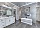 This bathroom features a soaking tub, fireplace, double vanities and access to the closet at 783 Blackberry Trl, Lawrenceville, GA 30043
