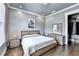 A neutral bedroom features hardwood floors, a cozy bed, and a walk-in closet at 783 Blackberry Trl, Lawrenceville, GA 30043