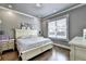 This bedroom offers hardwood floors, a window view, and great natural light at 783 Blackberry Trl, Lawrenceville, GA 30043