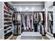Walk-in closet with custom shelving and drawers, providing ample storage space at 783 Blackberry Trl, Lawrenceville, GA 30043