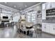 Formal dining area adjacent to the living room boasts ample natural light and stylish decor at 783 Blackberry Trl, Lawrenceville, GA 30043