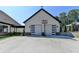 Modern detached two-car garage with a basketball hoop and sleek glass-paneled doors at 783 Blackberry Trl, Lawrenceville, GA 30043