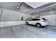 Spacious garage with epoxy floors, custom cabinets, and a car, perfect for storage and parking at 783 Blackberry Trl, Lawrenceville, GA 30043