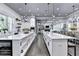Modern open-concept kitchen boasts double islands, stainless appliances, and great lighting at 783 Blackberry Trl, Lawrenceville, GA 30043