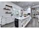 Stylish kitchen features white cabinetry, an expansive island, and modern appliances at 783 Blackberry Trl, Lawrenceville, GA 30043