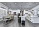 Gourmet kitchen featuring white cabinetry, pendant lighting, and a large island at 783 Blackberry Trl, Lawrenceville, GA 30043