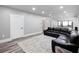 Spacious living room with wood floors, recessed lighting, and a modern, open-concept design at 783 Blackberry Trl, Lawrenceville, GA 30043