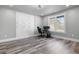 Bright home office with built-in storage, wood-look floors, and a view of the outdoors at 783 Blackberry Trl, Lawrenceville, GA 30043